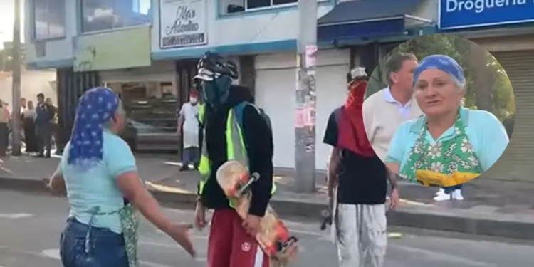 Valiente mujer desafía a encapuchados durante disturbios en el norte de Bogotá